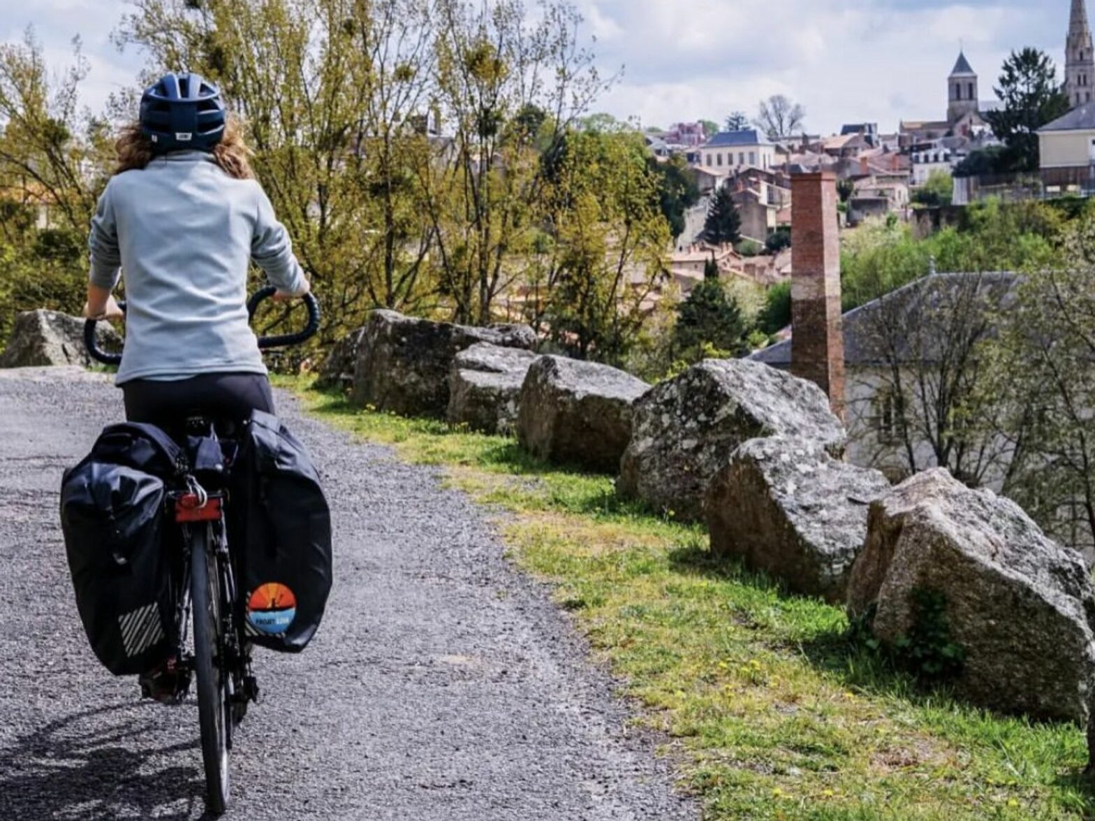 Woman biking at the Thouet Valley during a microadventure.