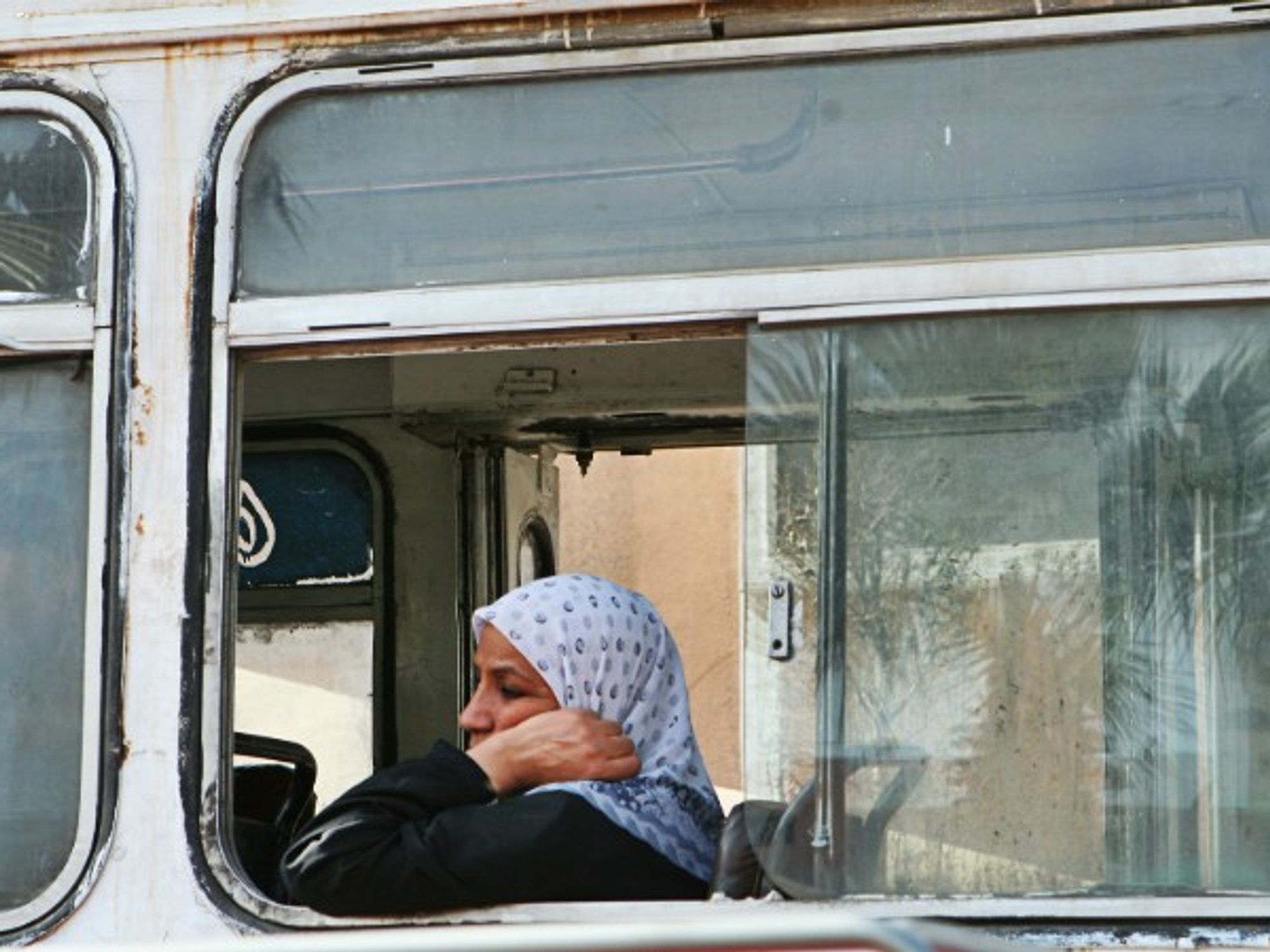 Woman on a bus in Cairo