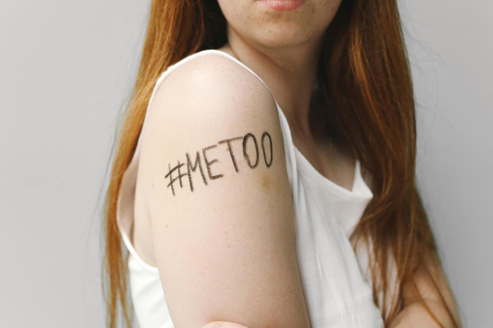 Woman With Me Too Written on Her Shoulder