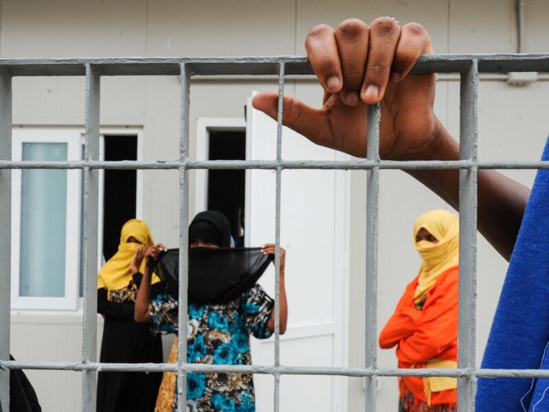 Women at a migrant reception center in Lampedusa, Italy