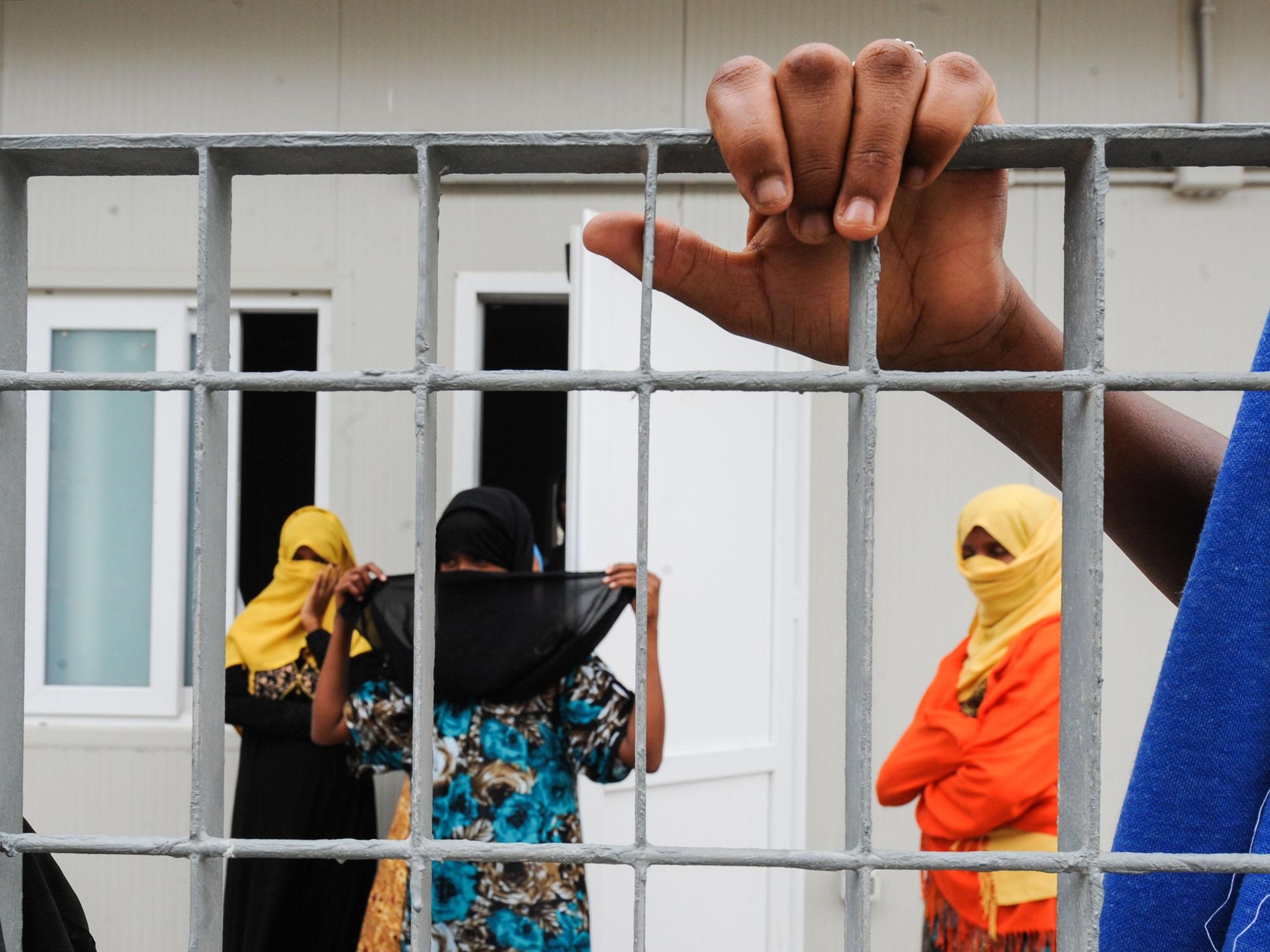 Women at a migrant reception center in Lampedusa, Italy