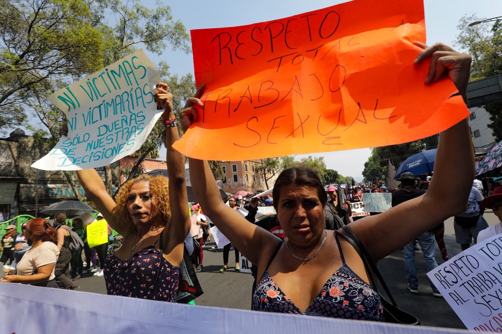 Women sex workers take part during a demonstration to demand better working conditions and an end to femicides and trans-femicide as part of International Workers' Day.