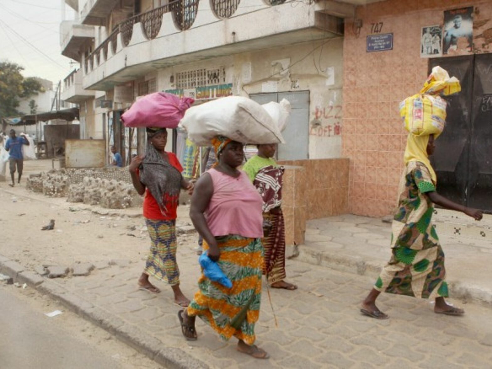 Women walking in Dakar, Senegal.