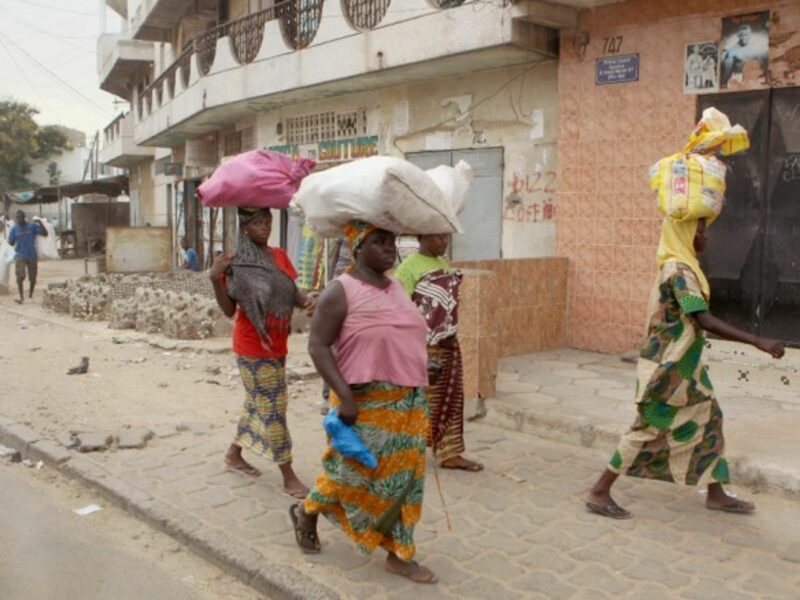 Women walking in Dakar, Senegal.