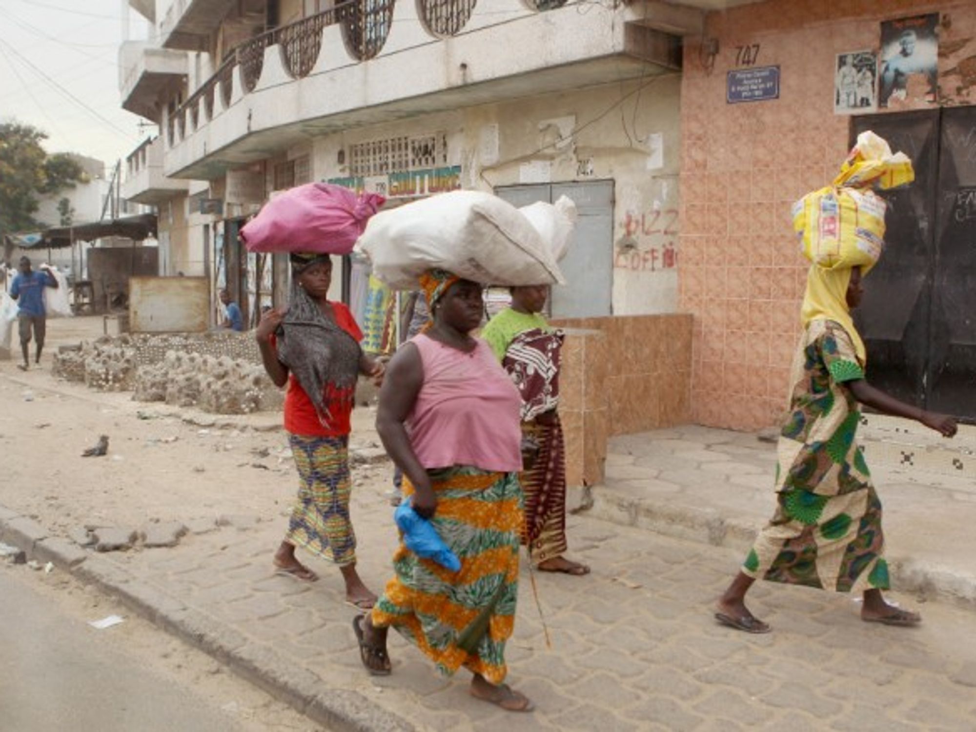 Women walking in Dakar, Senegal.