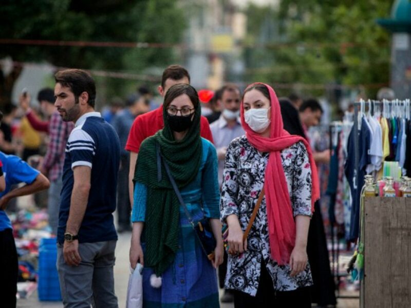 Women wearing masks shop at a bazaar in downtown Tehran, Iran.