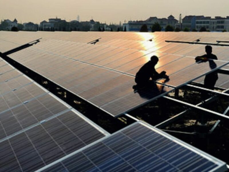 Workers at a solar power plant in China