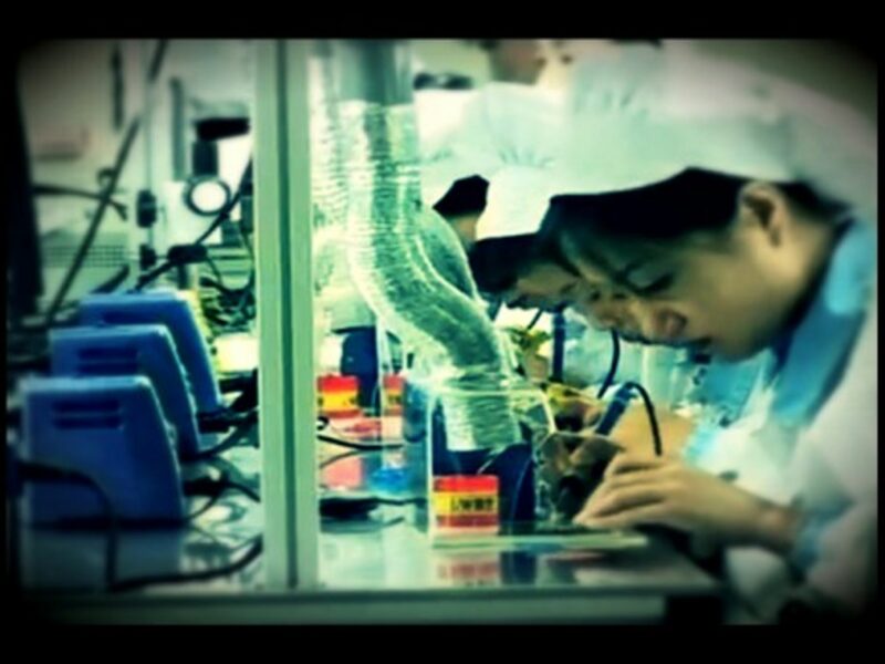 Workers at one of Kaesong industrial park's assembly lines