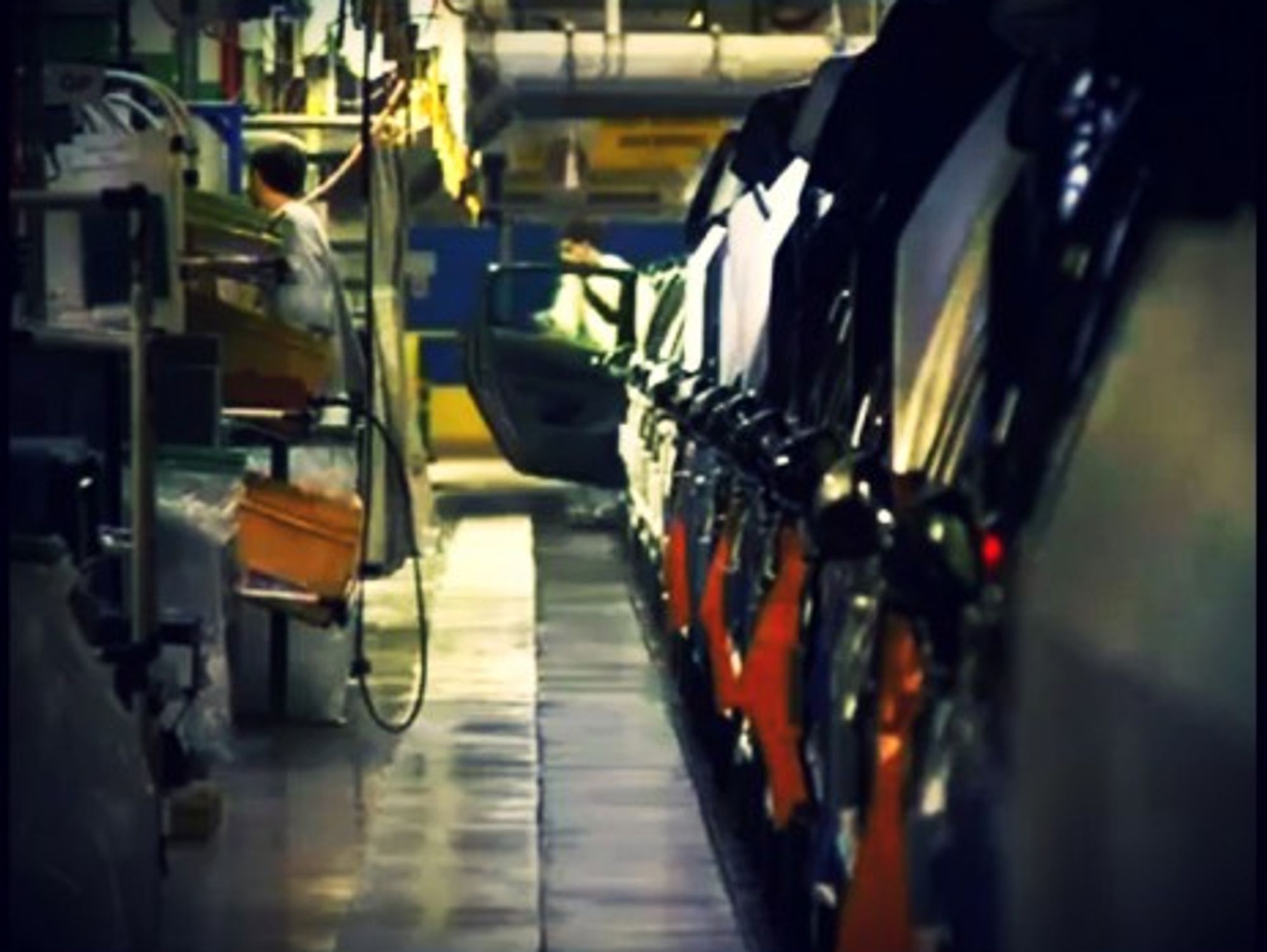 Workers at the Sochaux-MontbÃ©liard Peugeot factory