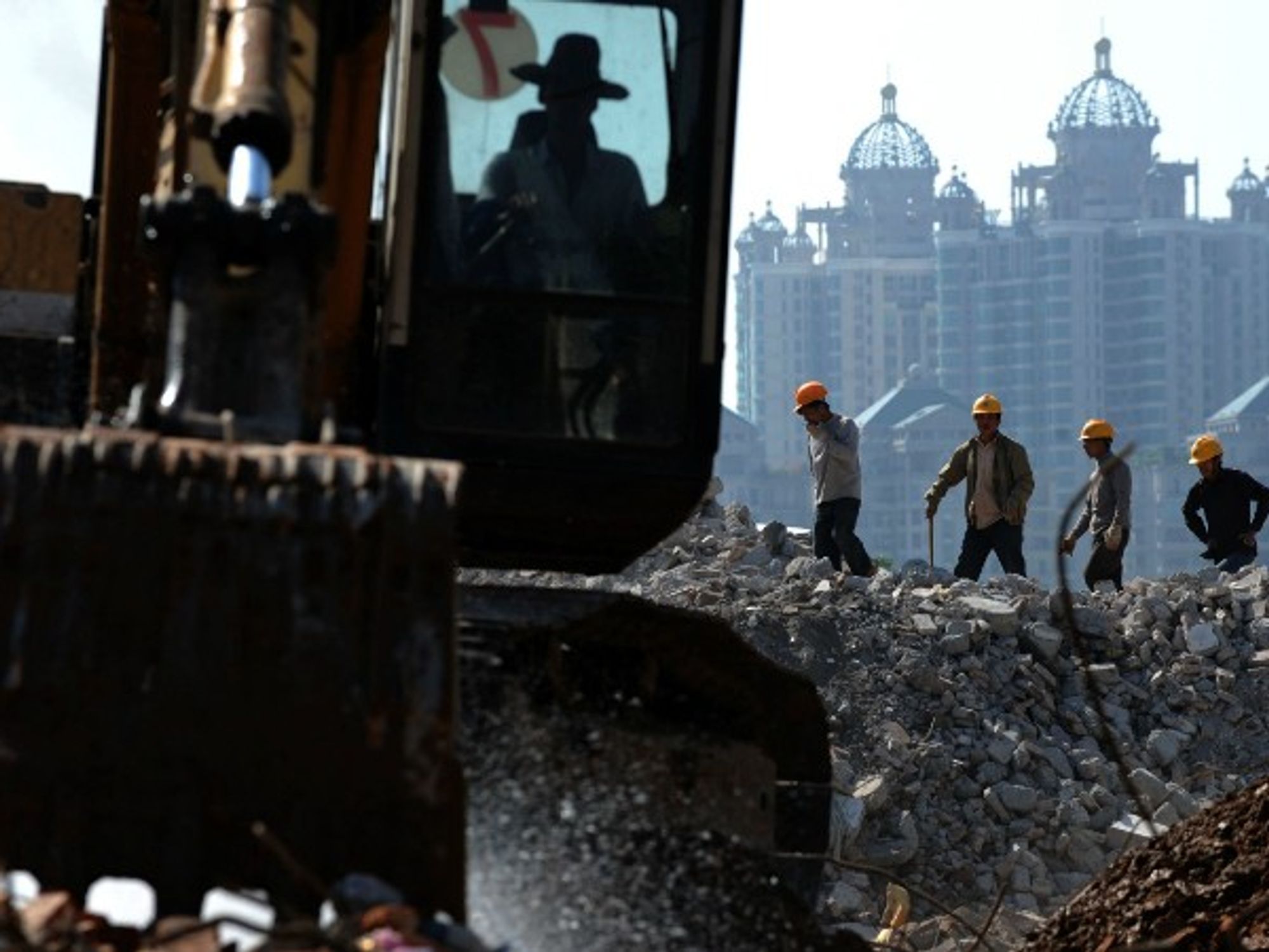 Workers dismantle buildings in Guangzhou