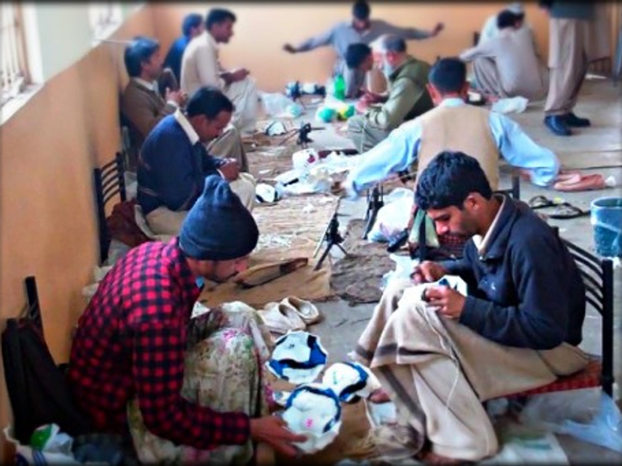 Workers in a soccer ball factory in Sialkot