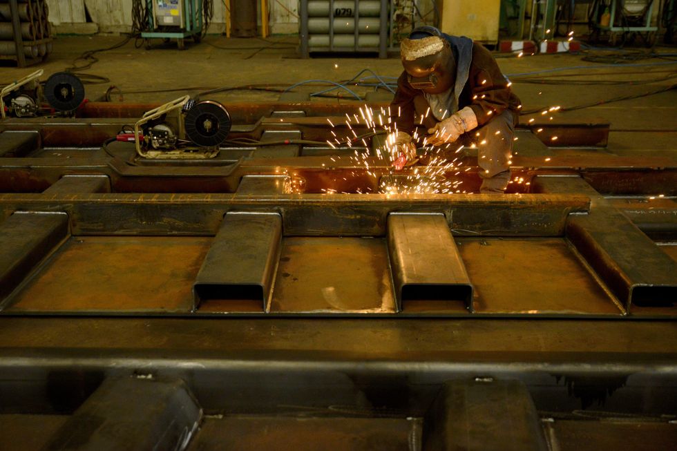Workers make mine carts in Jingjiang, China