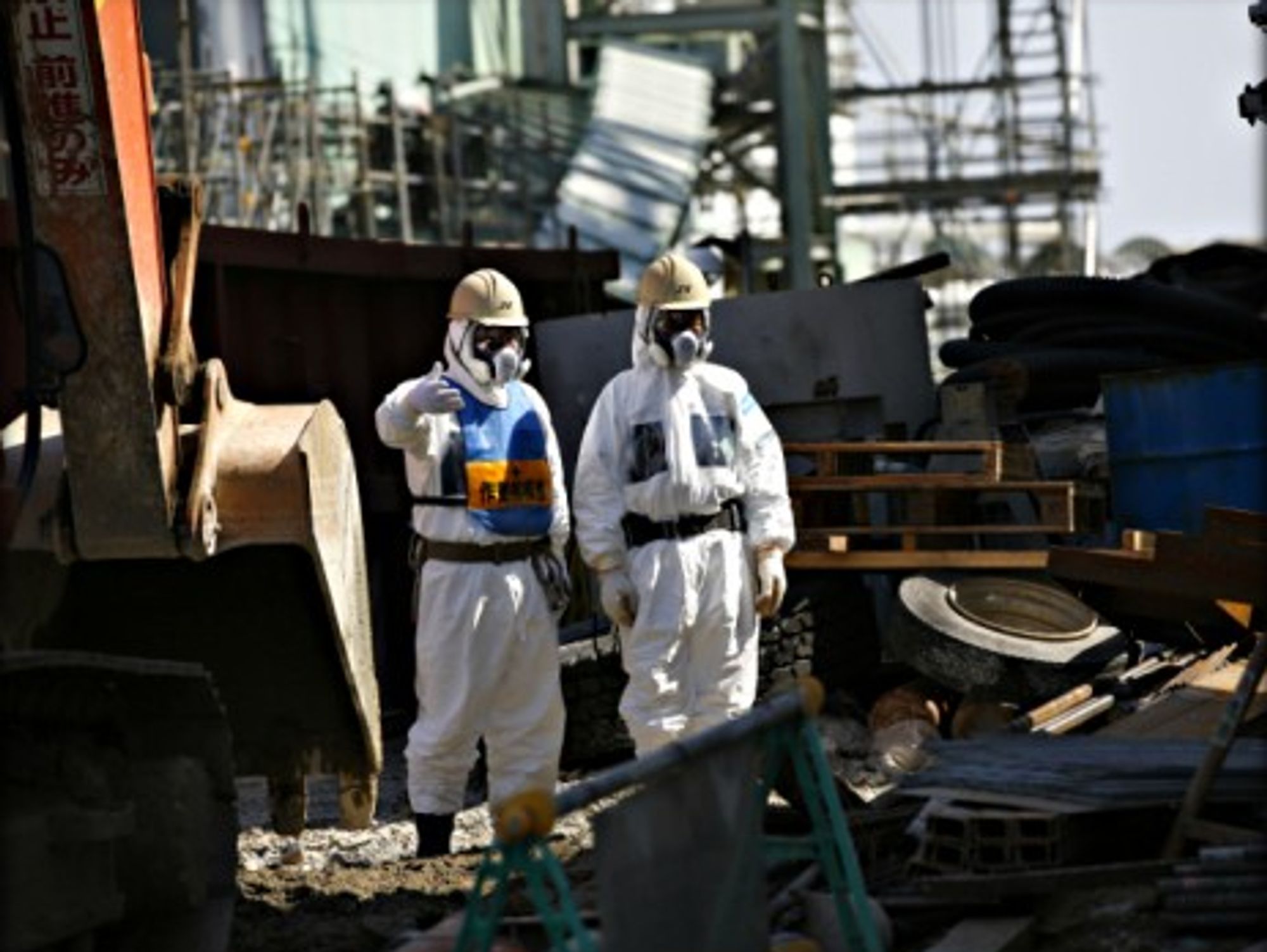 Workers next to Fukushima's No.4 reactor