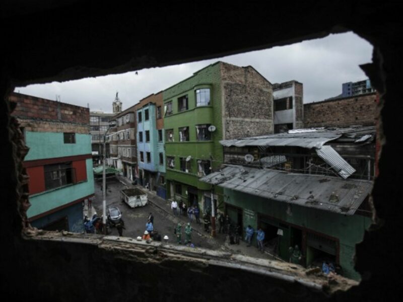 Workers prepare to demolish buildings in downtown Bogota in 2016.