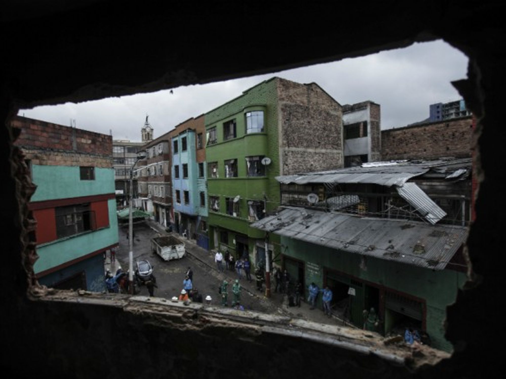 Workers prepare to demolish buildings in downtown Bogota in 2016.