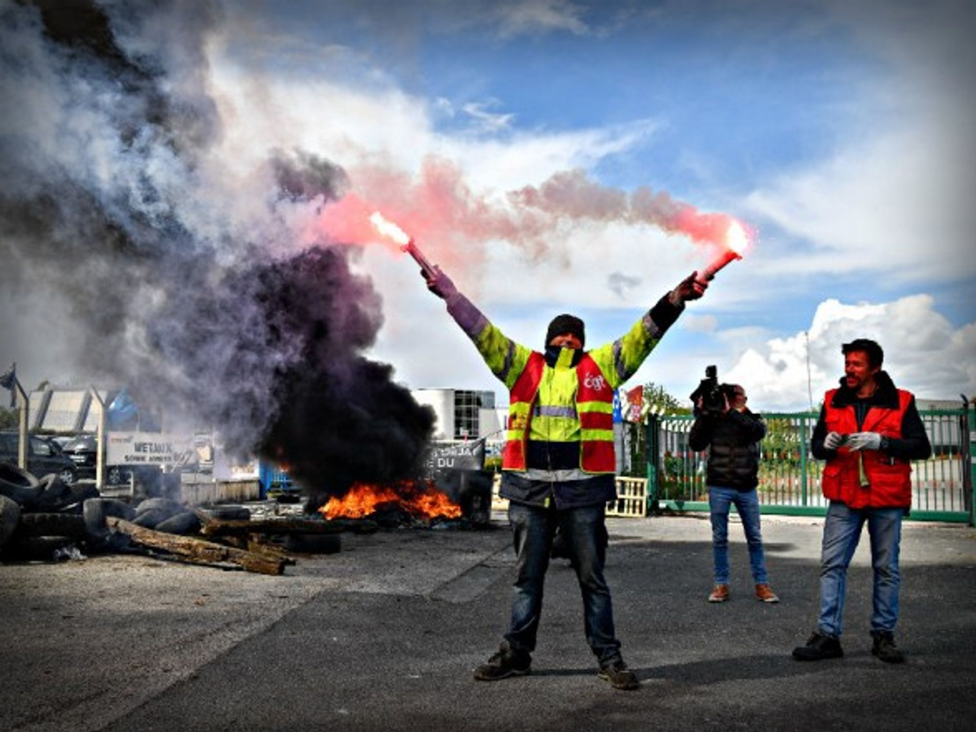 Workers protest at a Whirlpool plant slated for closure in France