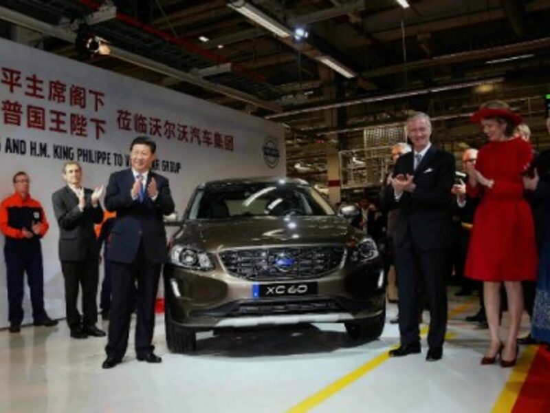 Xi Jinping and Belgian King Philippe unveil the 300,000th car to be exported to China during Xi's visit at Volvo's plant in Ghent.