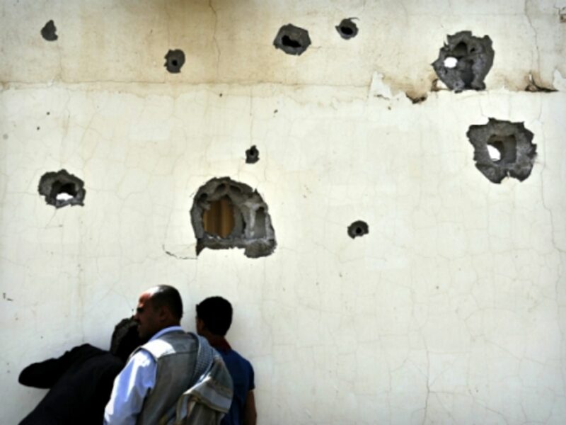 Yemenis in Sanaa after heavy shelling on July 10