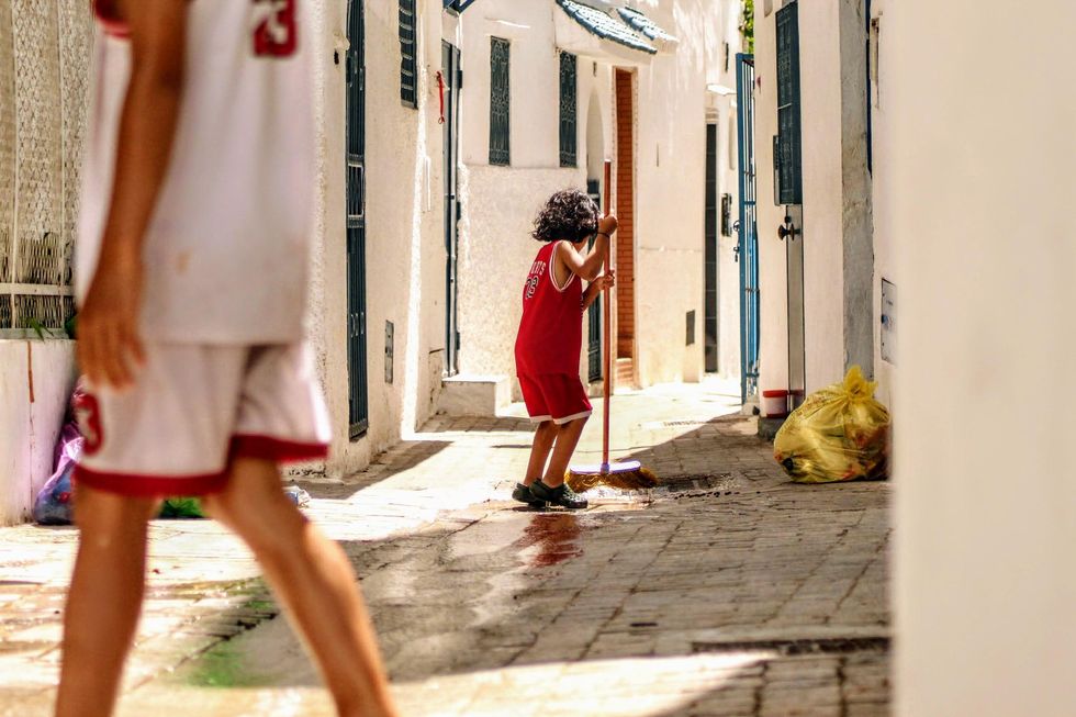 Young boy sweeping