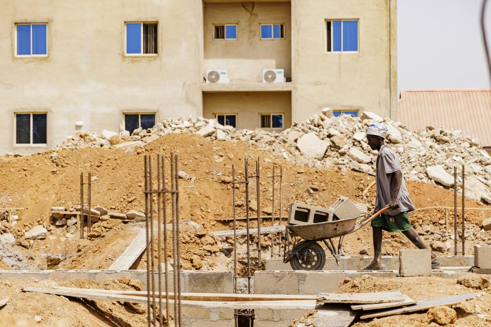 Young men work on a construction site in Nigeria, February 6th, 2024.