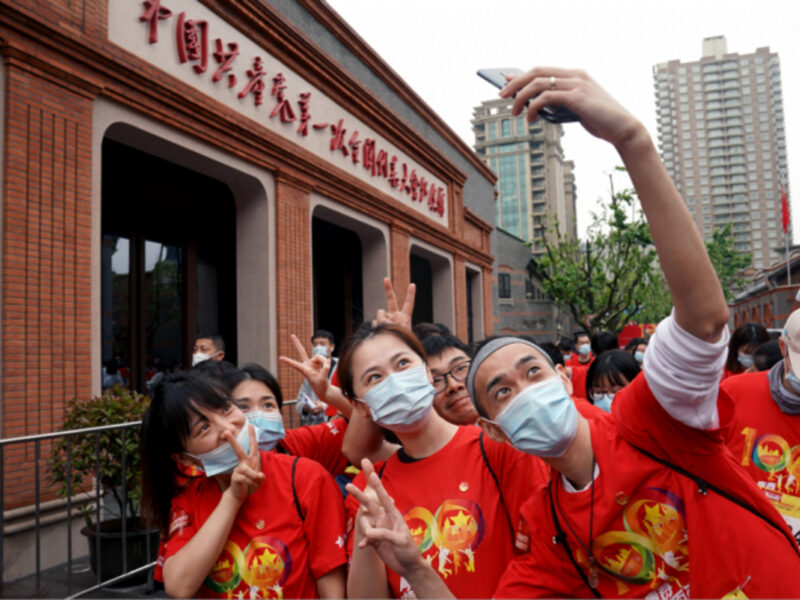 Young people pose for photos at the site of the first National Congress of the Communist Party of China in Shanghai