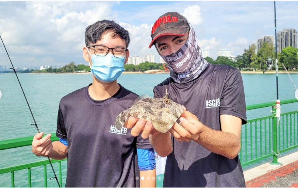 Young workers from the fishing equipment store SGFishingRigz in Singapore