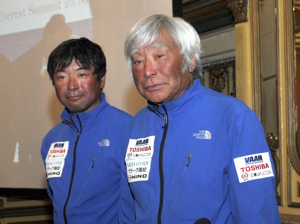 Yuichiro Miura (right) and his son after they climbed Mount Everest in 2013