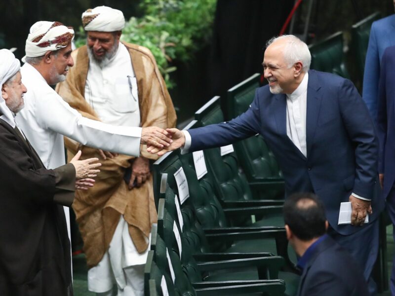 Zarif shakes hands with foreign guests in Tehran.