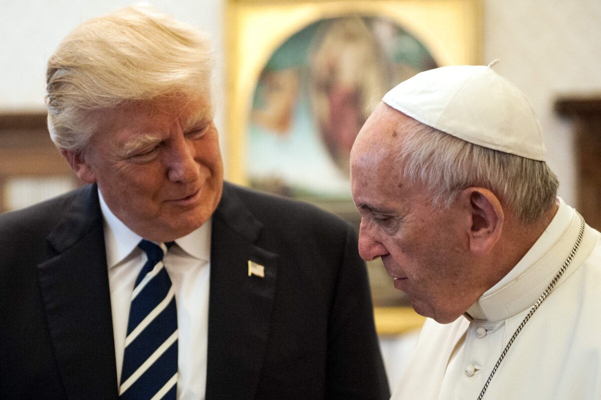 Pope Francis speaks with Donald Trump in 2017.