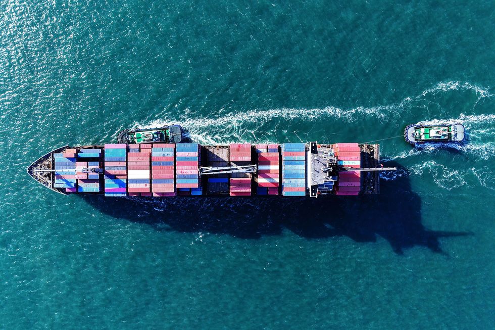 aerial photo of a A cargo ship loaded with foreign trade containers enters the port of Qingdao, Shandong province, China on April 2, 2025.