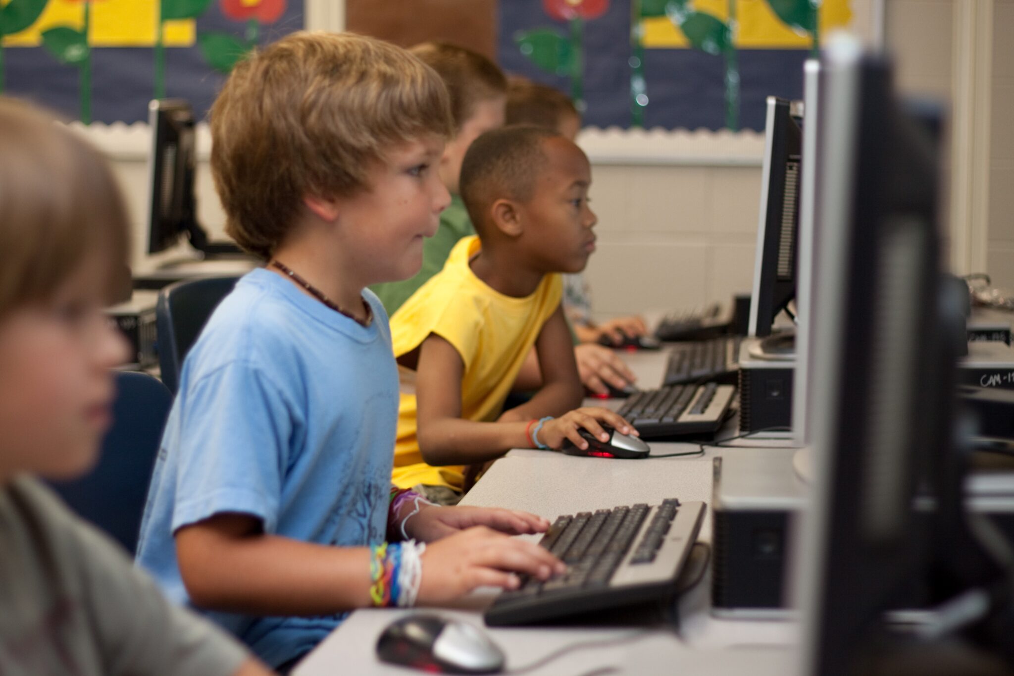 child on desktop in class
