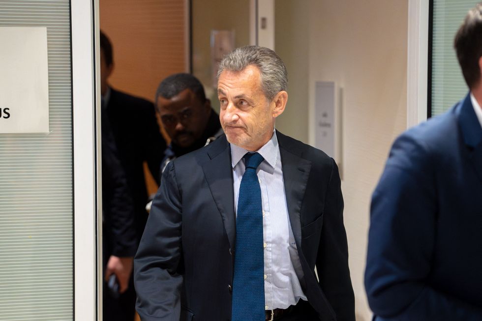 Former French President Nicolas Sarkozy leaving a hearing in Paris on March 27