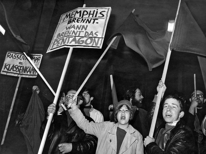 black and white photo of protesters with signs