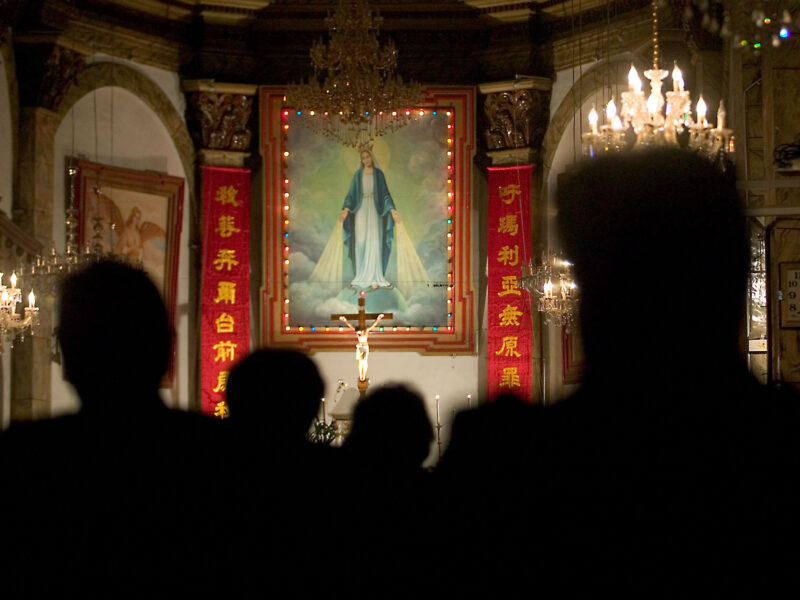 Chinese Catholic worshippers attend an early morning mass at the South Cathedral in Beijing in July 14, 2010