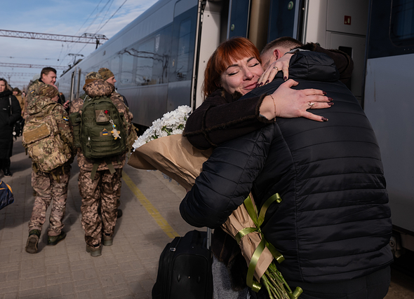 Family members say goodbye to their loved ones at the Kramatorsk train station in the Donetsk region of Ukraine on February 25, 2024.
