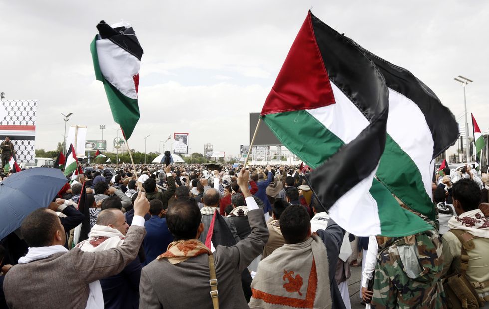 People shout slogans as they take part in a demonstration to protest the U.S. airstrikes on Yemen, in Sanaa, Yemen, March 28, 2025.