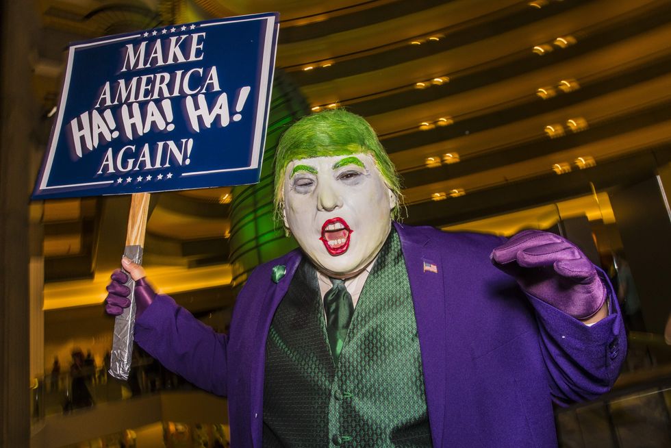 Photo of a protester disguised as a Donald Trump-Joker hybrid