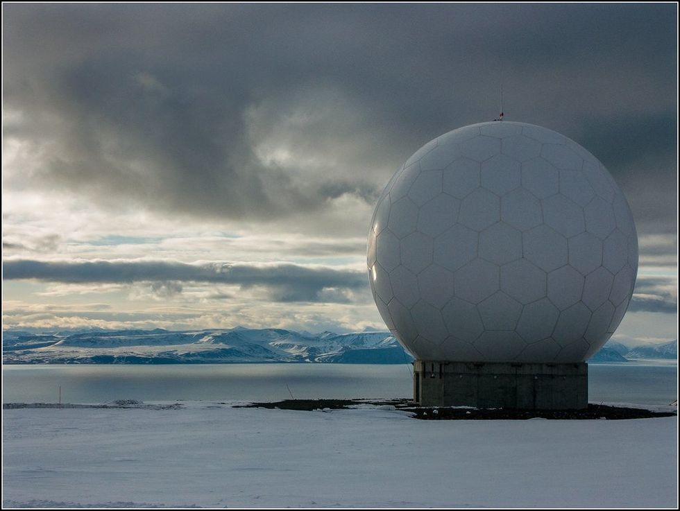 photo of a satellite that looks like a giant golf ball
