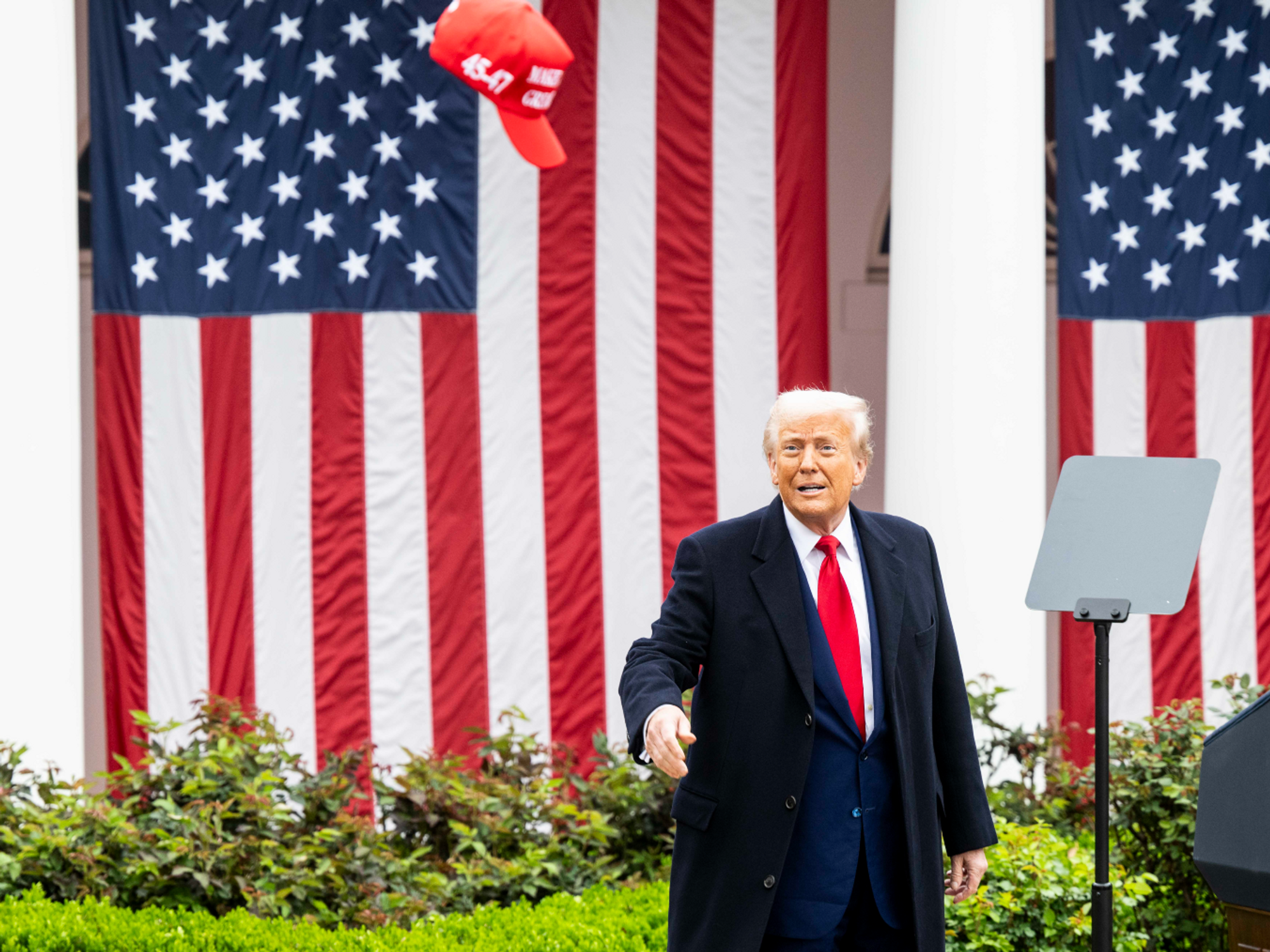 Photo of Trump throwing a MAGA hat