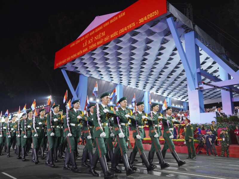 soldiers marching for 50th anniversary of the end of Vietnam War