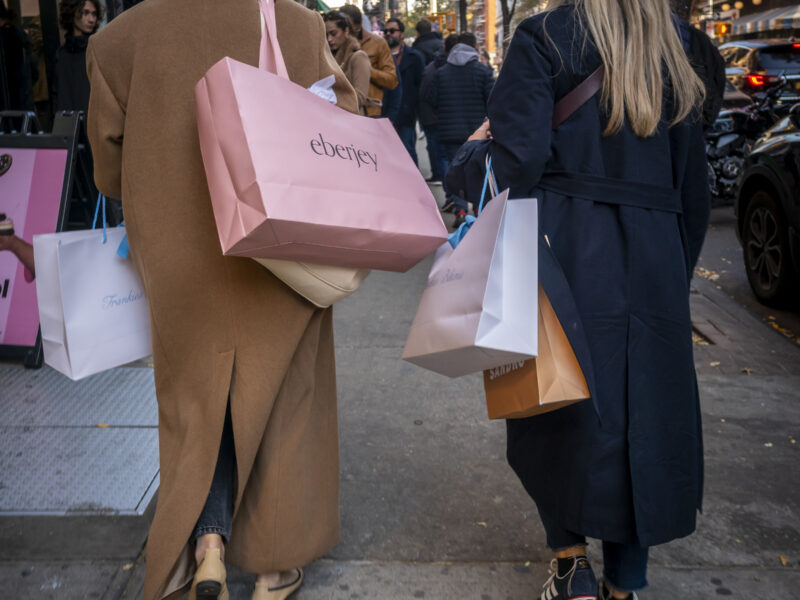 photo of women carrying shopping bags