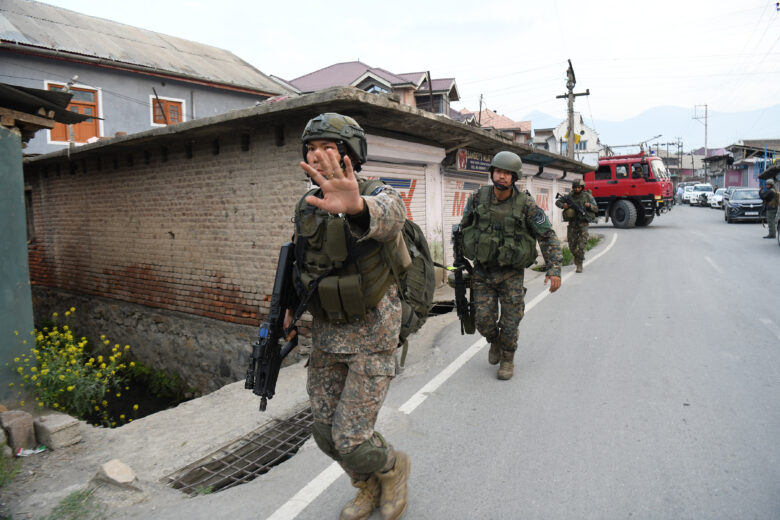 Photo of Indian Air force commandos near a scene following a plane crash in Pampore, India.