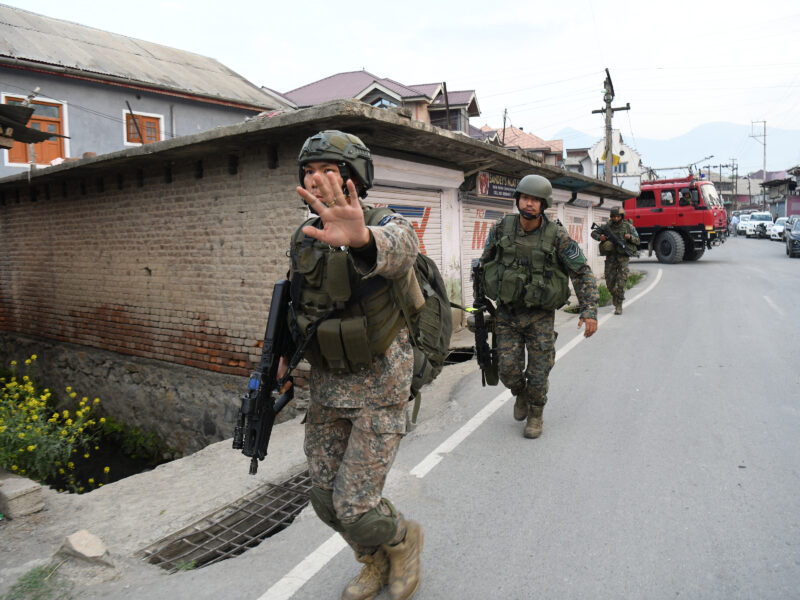 Photo of Indian Air force commandos near a scene following a plane crash in Pampore, India.