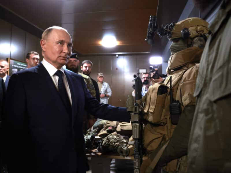 Russian President Vladimir Putin viewing a display of foreign weapons captured in Ukraine, during a visit to the Russian Special Forces School, on August 20, 2024 in Gudermes, Chechen Republic, Russia.