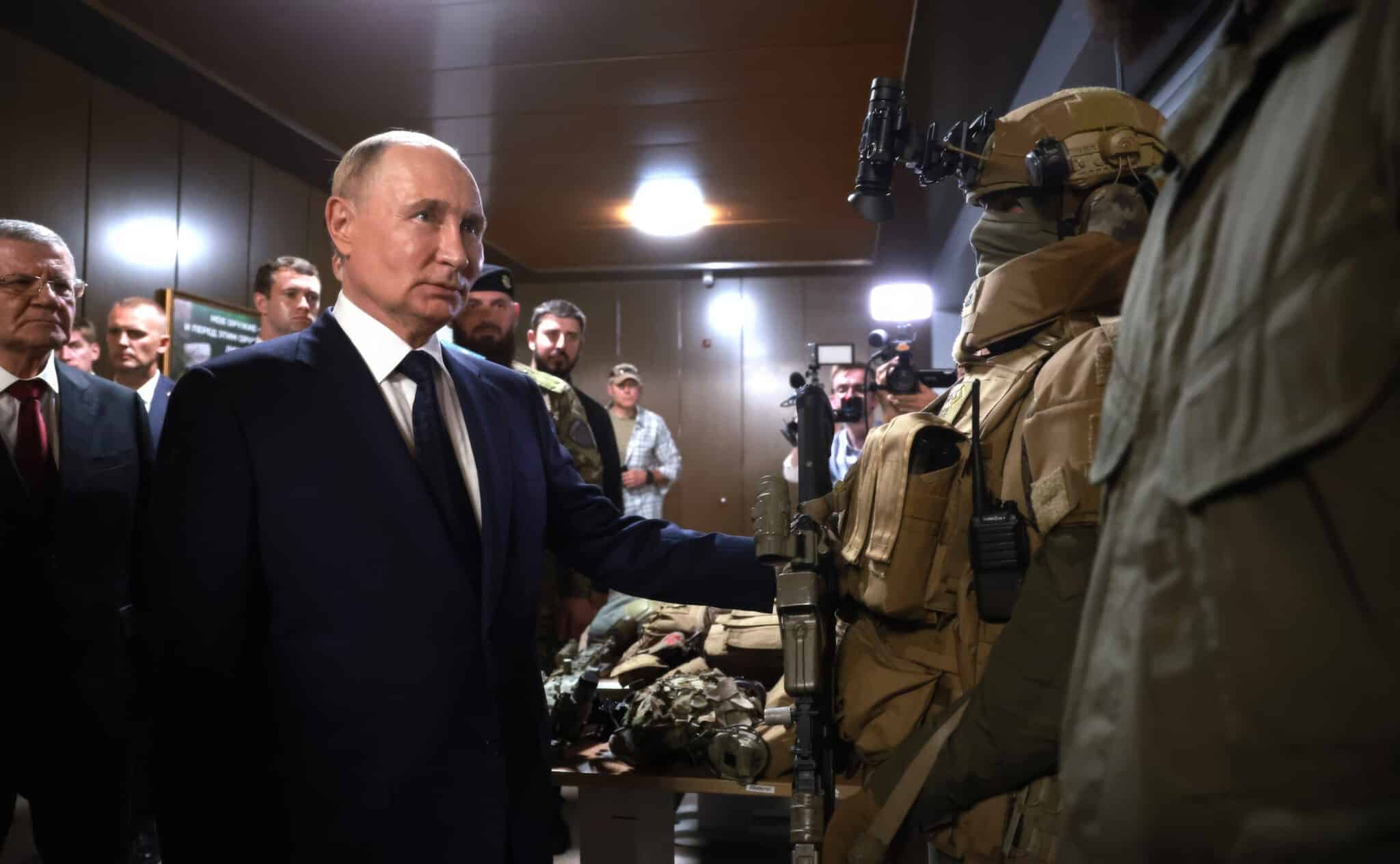 Russian President Vladimir Putin viewing a display of foreign weapons captured in Ukraine, during a visit to the Russian Special Forces School, on August 20, 2024 in Gudermes, Chechen Republic, Russia.