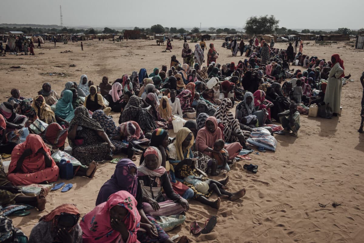 Sudanese women wait for the start of the monthly food distribution organized by UNHCR at Adre transit camp, Chad on June 24, 2024