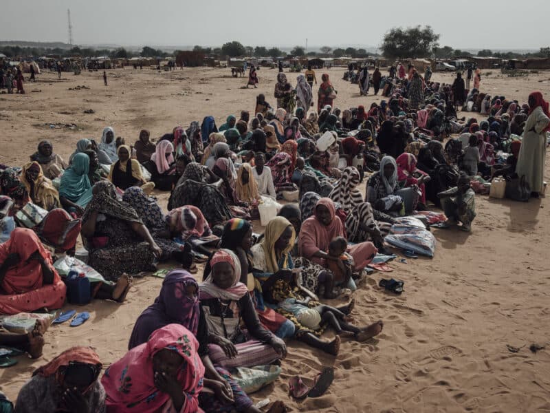 Sudanese women wait for the start of the monthly food distribution organized by UNHCR at Adre transit camp, Chad on June 24, 2024