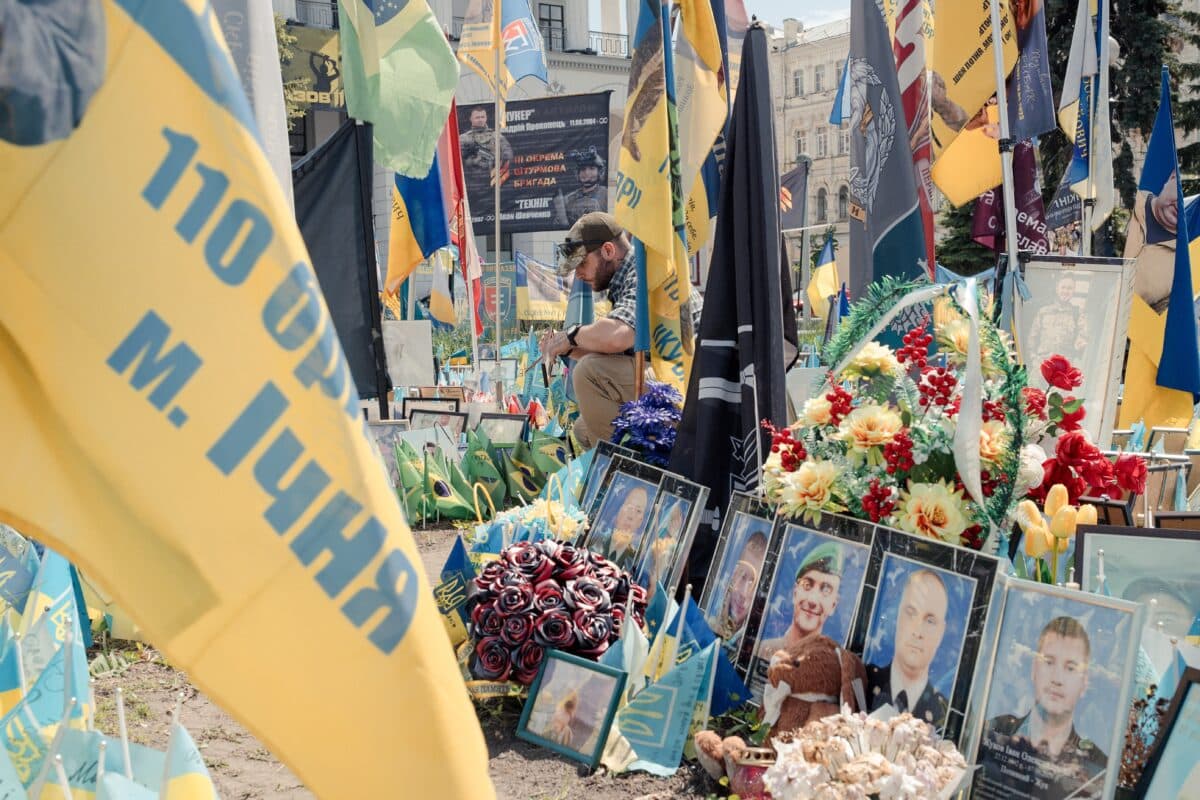 A soldier pays tribute to his fallen comrades at the Memorial in Maidan Square in Kyiv, Ukraine on May 14, 2025.