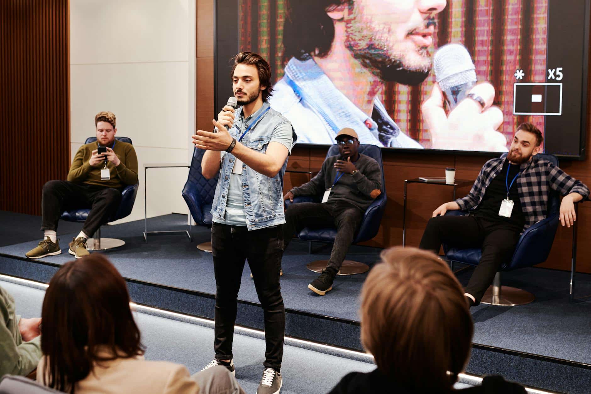a man confident talking using microphone