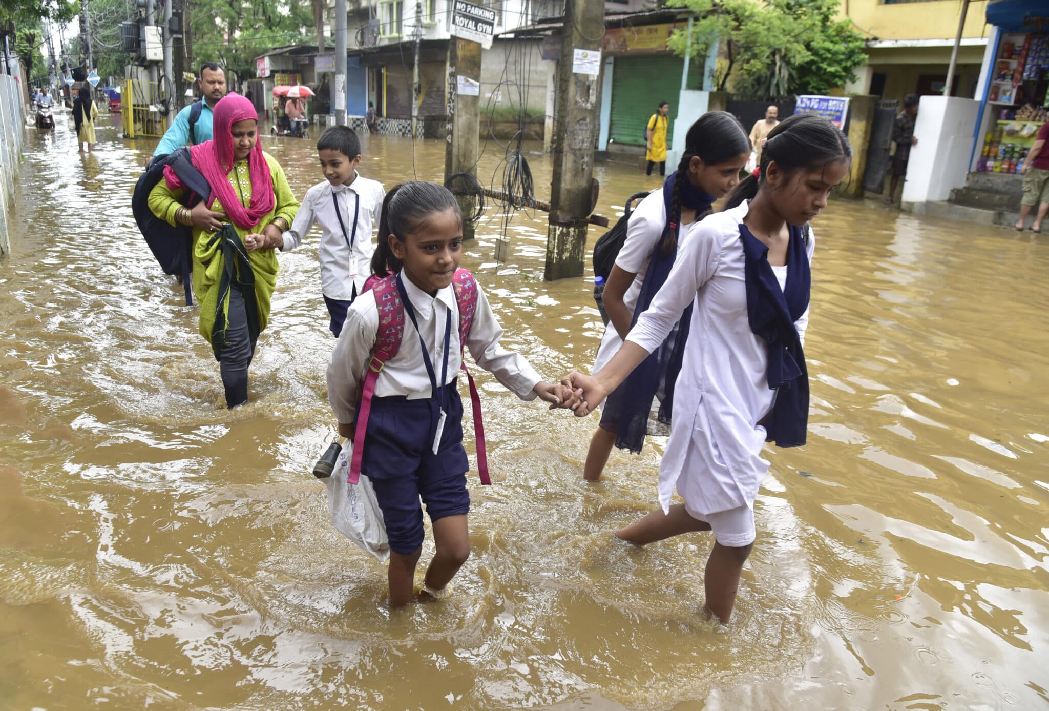 School students wade through water-logged streets after heavy downpours in Guwahati, in India's northeastern Assam state. Parts of India have experienced their wettest May in more than a century, with the unusually early arrival of the monsoon season causing a ferocious downpour.